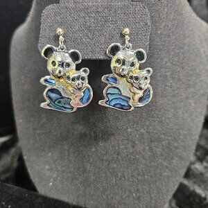 Silver tone koala earrings with shell appearance accents